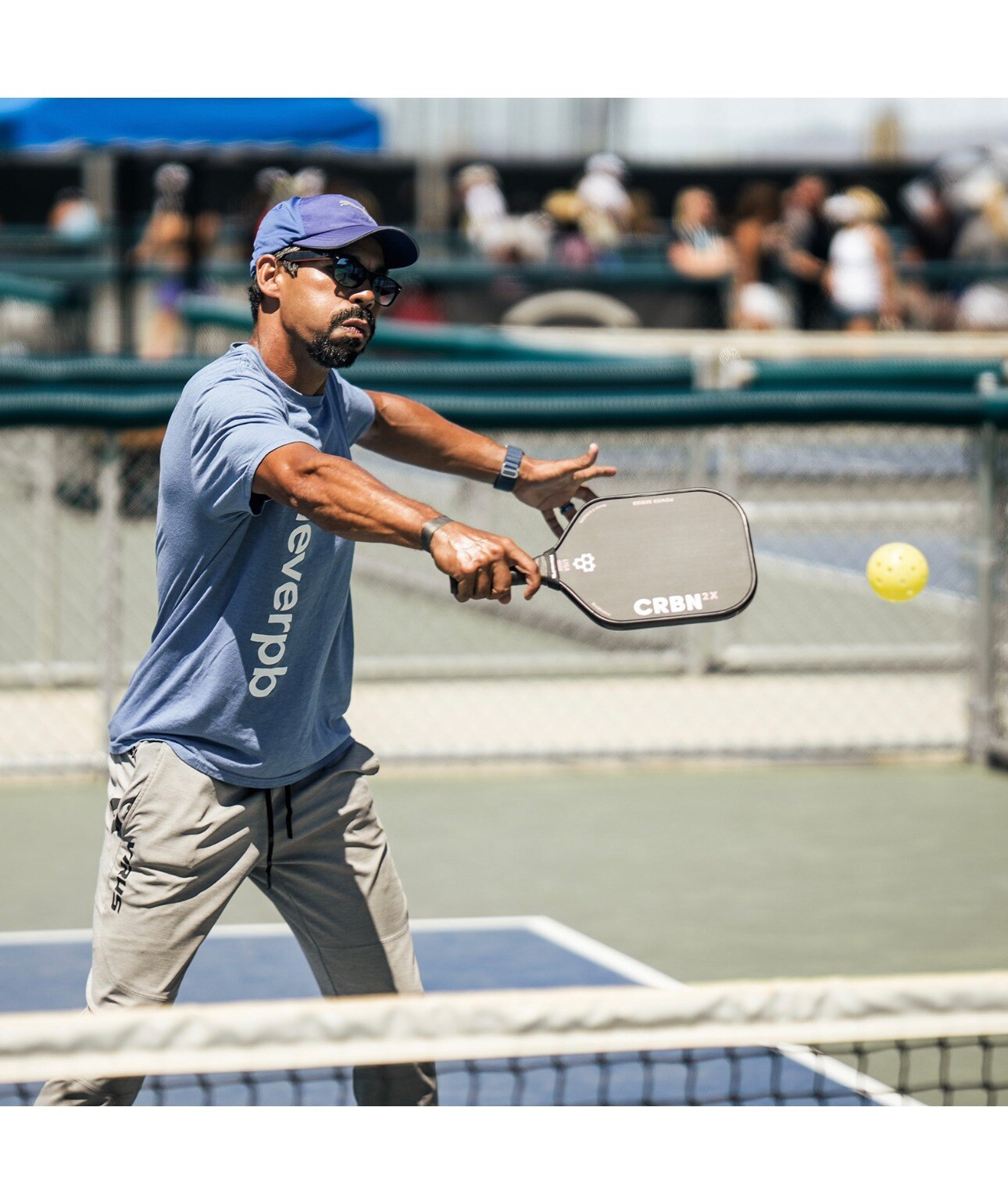 Ivan Da Silva playing a right-handed forehand on a pickleball court